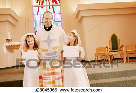 Priest with two children View Large Photo Image Stock Photography - Priest with two children. Fotosearch