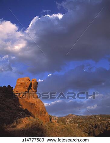 Red rock butte and clouds, Dinosaur National Monument, Colorado, USA View Large Photo Image Stock Photo - Red rock butte and clouds, Dinosaur National Monument, Colorado, USA. Fotosearch