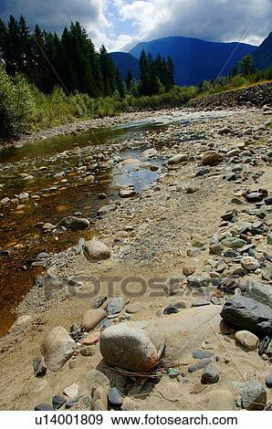 Rock and sand shoreline View Large Photo Image Stock Photo - Rock and sand shoreline. Fotosearch