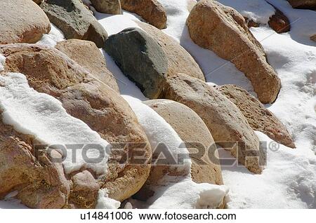 Rocks and snow View Large Photo Image Stock Photograph - Rocks and snow. Fotosearch