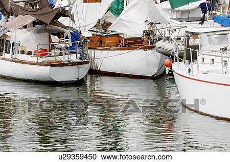 Stock Image - Sailboats in marine. Fotosearch