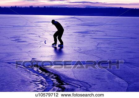 Skating on a frozen lake View Large Photo Image Stock Image - Skating on a frozen lake. Fotosearch