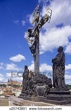 Statue at base of cross View Large Photo Image Stock Image - Statue at base of cross. Fotosearch