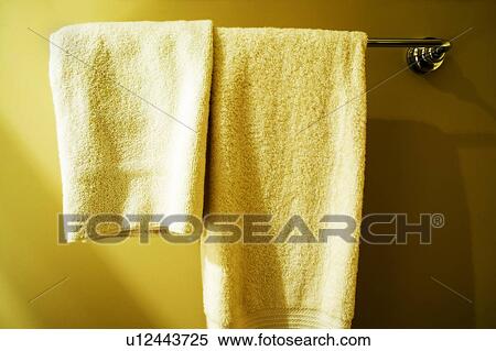 Towels hanging on a towel rack View Large Photo Image Stock Photography - Towels hanging on a towel rack. Fotosearch