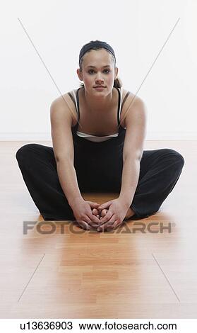 Woman doing stretches View Large Photo Image Stock Image - Woman doing stretches. Fotosearch