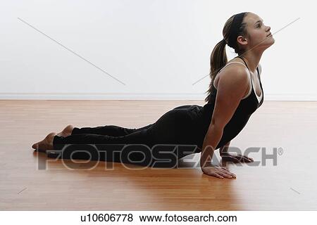Stock Photo - Woman doing stretches. Fotosearch