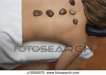 Woman receives alternative therapy View Large Photo Image Stock Image - Woman receives alternative therapy. Fotosearch