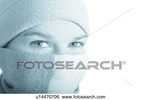 Stock Photograph - Woman wearing toque and scarf. Fotosearch
