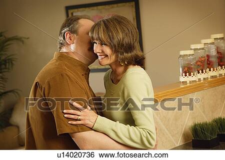 A couple embrace View Large Photo Image Stock Photograph - A couple embrace. Fotosearch