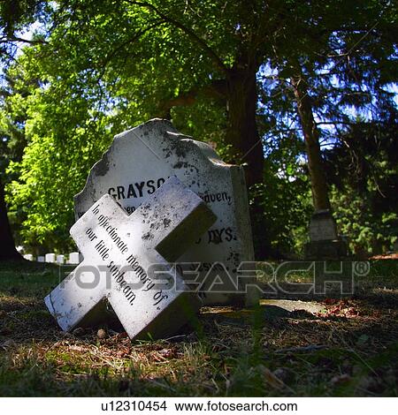 A grave in the sunlight. View Large Photo Image Picture - A grave in the sunlight.. Fotosearch