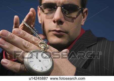 Stock Photo - A man with time on his hands. Fotosearch