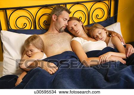 A young family taking a nap View Large Photo Image Picture - A young family taking a nap. Fotosearch