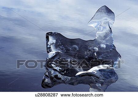 Stock Photo - Abstract ice formation on water. Fotosearch