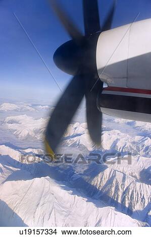 Airplane in Flight crossing Mountains View Large Photo Image Picture - Airplane in Flight crossing Mountains. Fotosearch