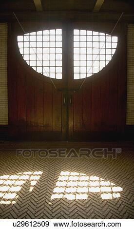 An odd shaped window letting in light View Large Photo Image Stock Photo - An odd shaped window letting in light. Fotosearch