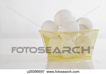 Stock Photo - Basket of eggs. Fotosearch