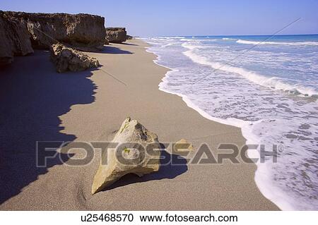 Big rock on a beach View Large Photo Image Stock Image - Big rock on a beach. Fotosearch