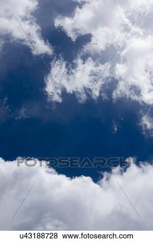 Blue sky and clouds View Large Photo Image Stock Photo - Blue sky and clouds. Fotosearch