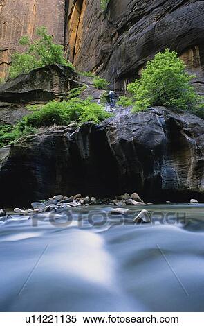 Blurred water and rocky cliffs View Large Photo Image Stock Photography - Blurred water and rocky cliffs. Fotosearch