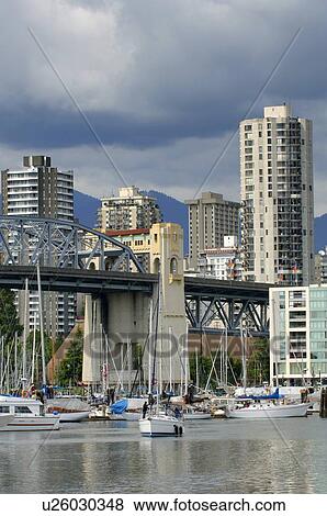 Stock Photo - Boats in busy harbour. Fotosearch