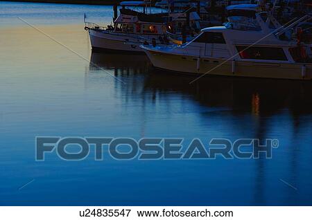 Boats retiring for the evening View Large Photo Image Stock Photo - Boats retiring for the evening. Fotosearch