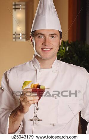 Chef holding tropical drink View Large Photo Image Stock Photo - Chef holding tropical drink. Fotosearch