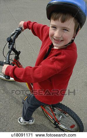 Child on a bicycle View Large Photo Image Stock Image - Child on a bicycle. Fotosearch