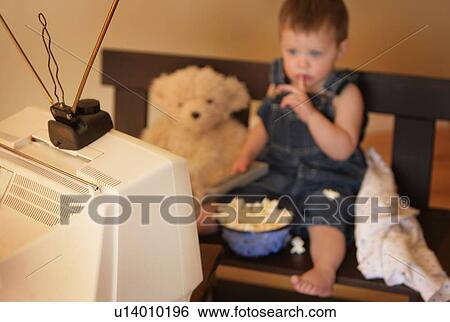 Child watching television View Large Photo Image Stock Photograph - Child watching television. Fotosearch