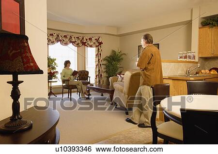 Couple at home View Large Photo Image Stock Photograph - Couple at home. Fotosearch