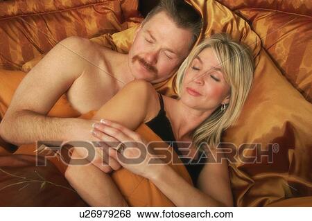 Couple sleeping together View Large Photo Image Stock Photo - Couple sleeping together. Fotosearch