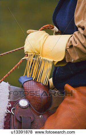 Stock Photo - Cowboy on horseback. Fotosearch