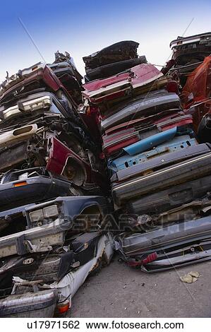 Stock Image - Crushed cars piles. Fotosearch