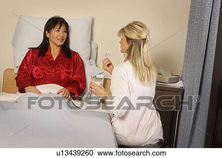 Doctor giving patient prescription View Large Photo Image Stock Image - Doctor giving patient prescription. Fotosearch