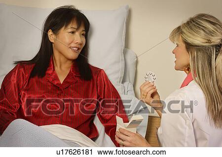 Doctor giving patient prescription View Large Photo Image Stock Image - Doctor giving patient prescription. Fotosearch