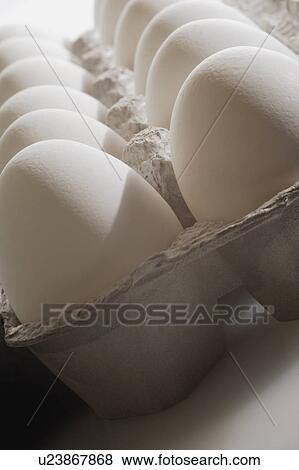 Stock Photo - Eggs in a carton. Fotosearch