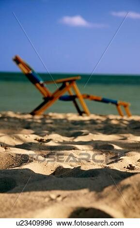 Empty beach chair View Large Photo Image Stock Photograph - Empty beach chair. Fotosearch