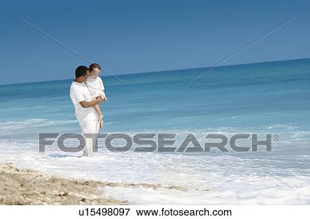 Father and child on the beach View Large Photo Image Stock Photo - Father and child on the beach. Fotosearch