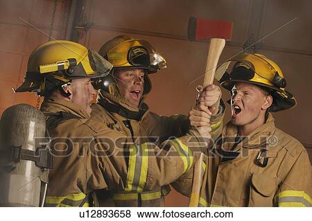 Firefighters with axe View Large Photo Image Stock Photo - Firefighters with axe. Fotosearch