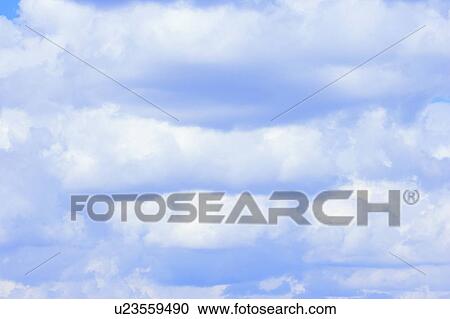 Fluffy clouds in sky View Large Photo Image Stock Image - Fluffy clouds in sky. Fotosearch