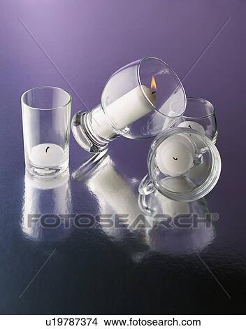 Four candles on reflective surface View Large Photo Image Picture - Four candles on reflective surface. Fotosearch