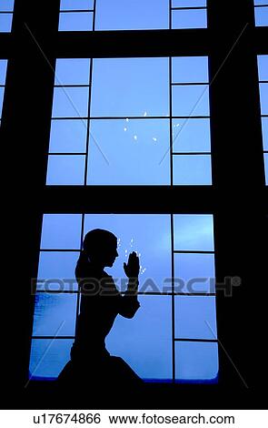 Stock Photograph - Girl praying. Fotosearch