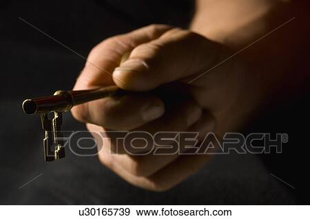 Hand holding key View Large Photo Image Stock Photo - Hand holding key. Fotosearch