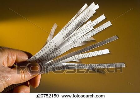 Stock Image - Hand holding shredded paper. Fotosearch