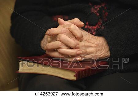 Stock Photo - Hands in prayer. Fotosearch