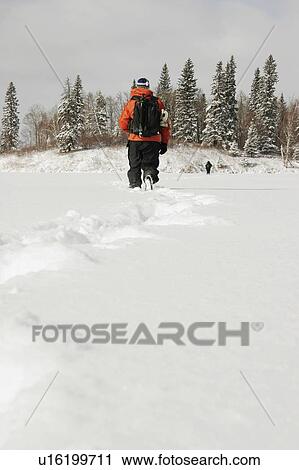 Stock Image - Hiking in the snow. Fotosearch