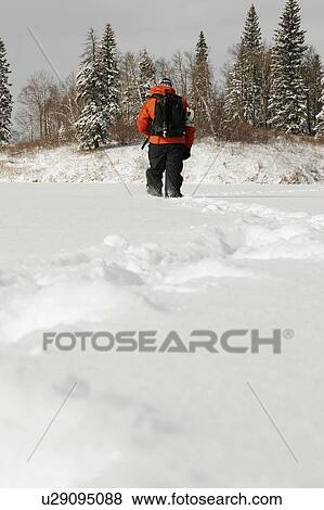 Hiking in the snow View Large Photo Image Stock Photo - Hiking in the snow. Fotosearch
