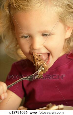 Little girl eating cake View Large Photo Image Stock Photography - Little girl eating cake. Fotosearch