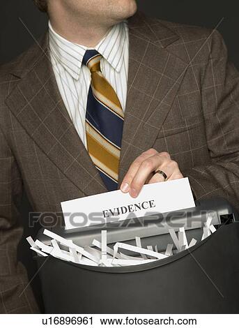 Man shredding evidence View Large Photo Image Stock Image - Man shredding evidence. Fotosearch
