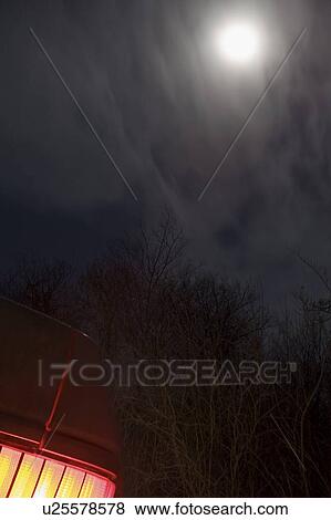 Stock Photo - Moon behind clouds. Fotosearch