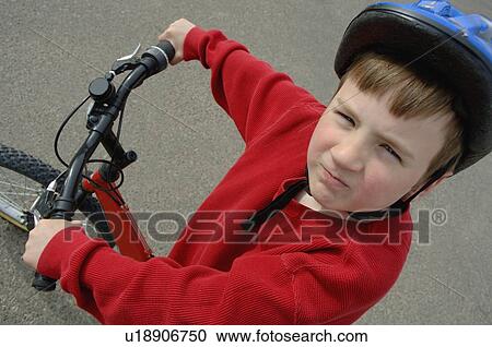 Stock Image - One young tough biker. Fotosearch